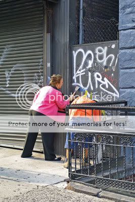 Gale Brewer Council Member Gale Brewer (left), recently worked with the 24th Precinct to remove graffiti from the security gates of 29 local businesses. Photo courtesy of Gale Brewers office.