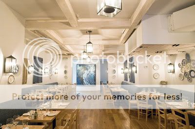 The blue-tiled maritime mosaic on the back wall is an artistic punctuation to the restaurant’s fittingly azure color scheme.