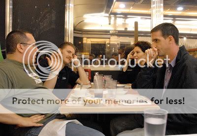 Matthew Hindin Matthew Hindin, right, discusses the campaign inside the Mayfair Diner with fellow McCain volunteers.
