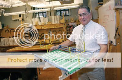 Saint Bernards2 St. Bernards carpentry teacher Michael Falcone displays student work.