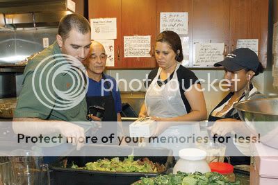 Chef and nutritionist Mark D’Alessandro looks over the work of (from left) Manny Ramos, Julissa Lopez and Matilde Lachapel. Photo by Andrew Schwartz