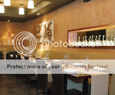 Glass pitchers with thin spouts, otherwise known as “porróns,” line the back walls of the restaurant.