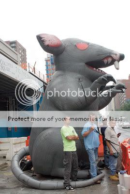 Union representatives surround a giant inflatable rat. photo by Andrew Schwartz