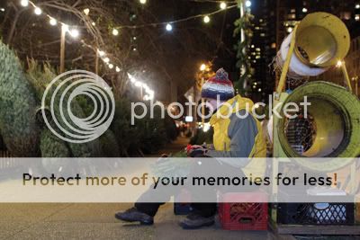 Joel makes wreaths while waiting for late night customers on the East Side. Photo by Andrew Schwartz